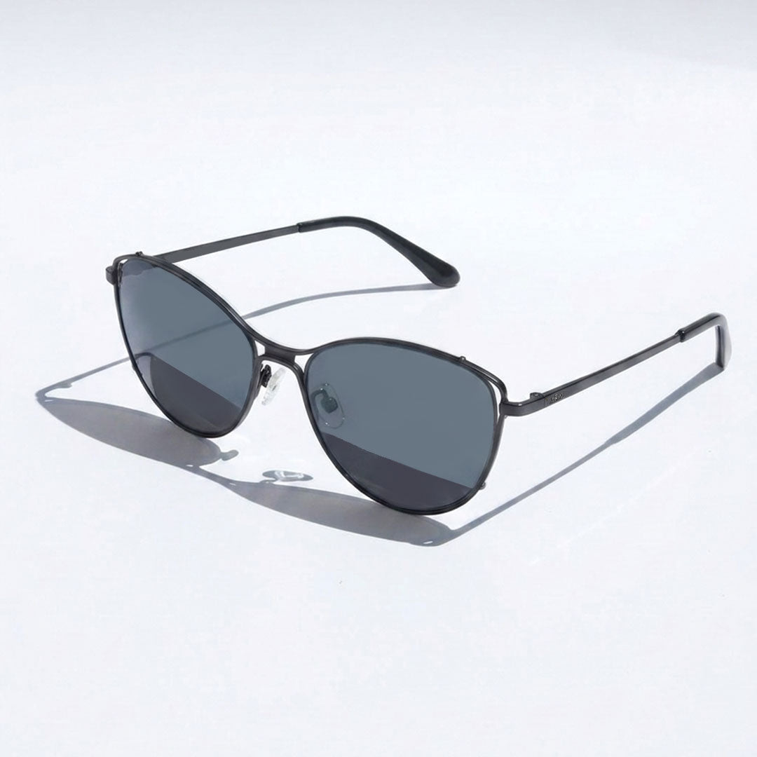 Sunglasses with dark lenses and thin metal frame on a light gray background
