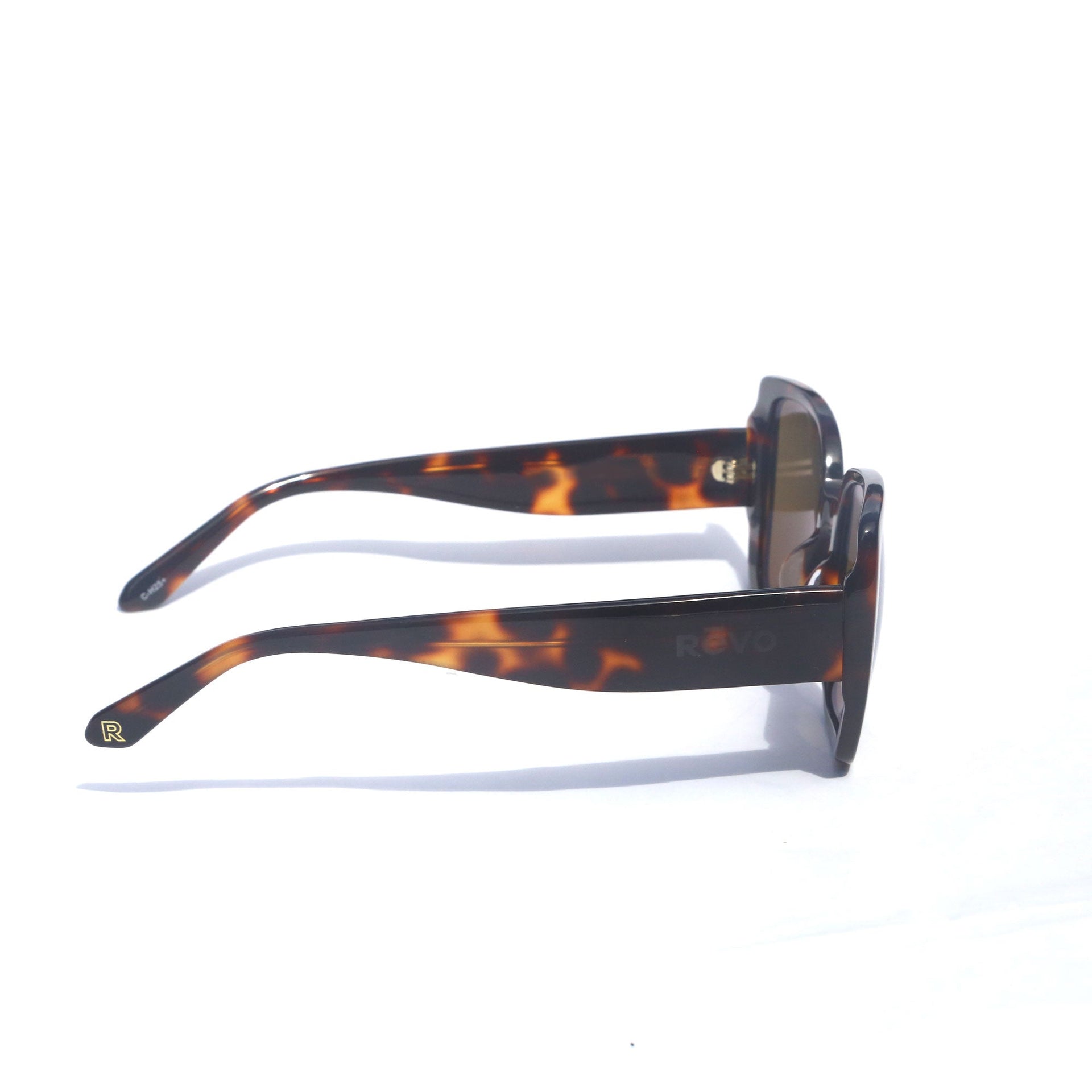 Sunglasses with tortoiseshell frame and white arms on a white background